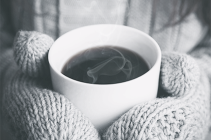 Hot coffee at cozy bed