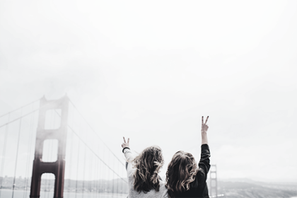2 Happy woman behind 6the
								golden gate bridge